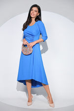 Rochia Celine din jerseu elastic albastru, croi asimetric și detaliu drapat